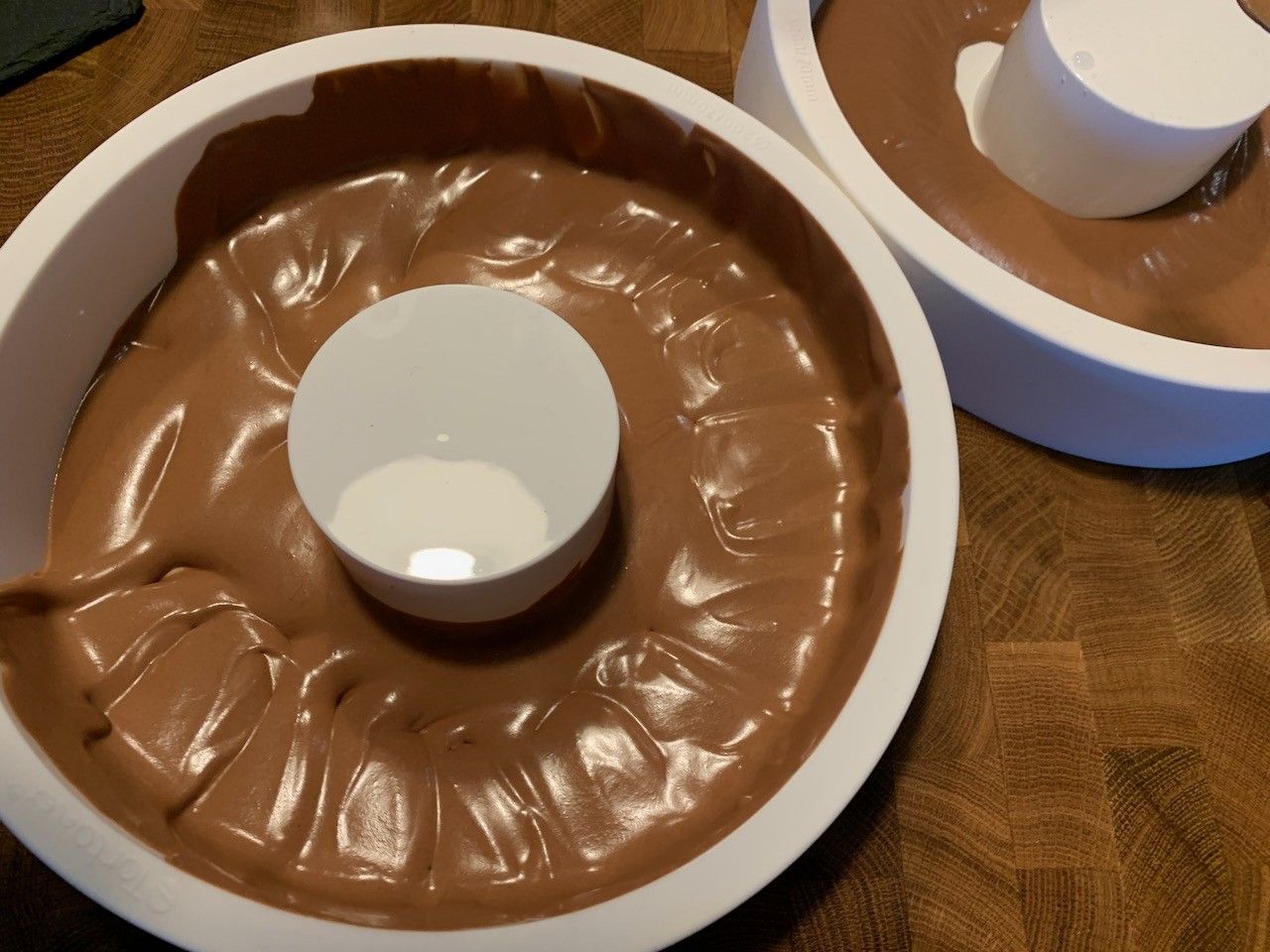 Filling the entremet mold with the first layer of mousse